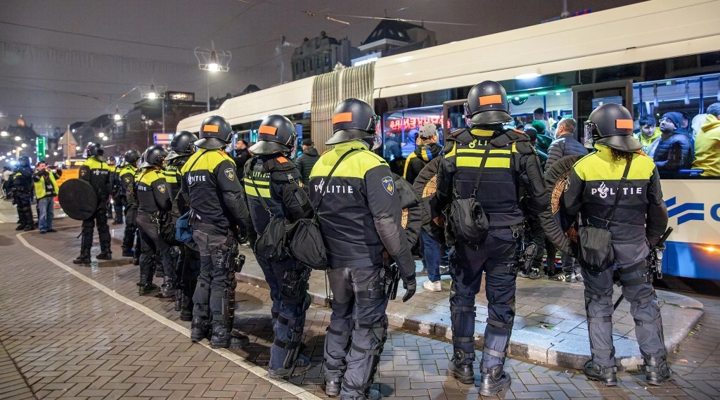 Dutch Police stand guard after attacks on Israeli fans following the soccer game between Ajax and Maccabi Tel Aviv in Amsterdam on November 8, 2024.